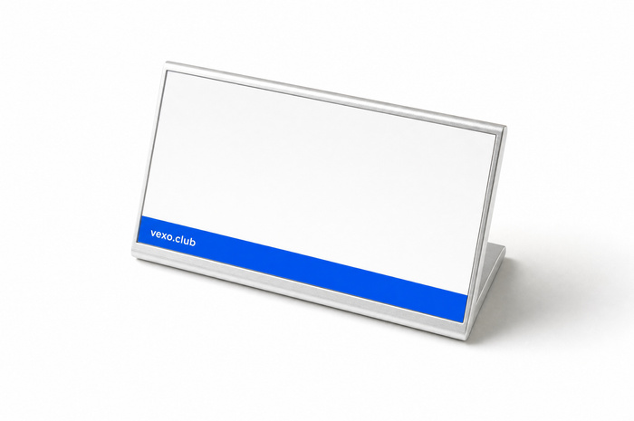 Desk nameplate in a clear stand with a blue strip printed vexo.club, the name left blank