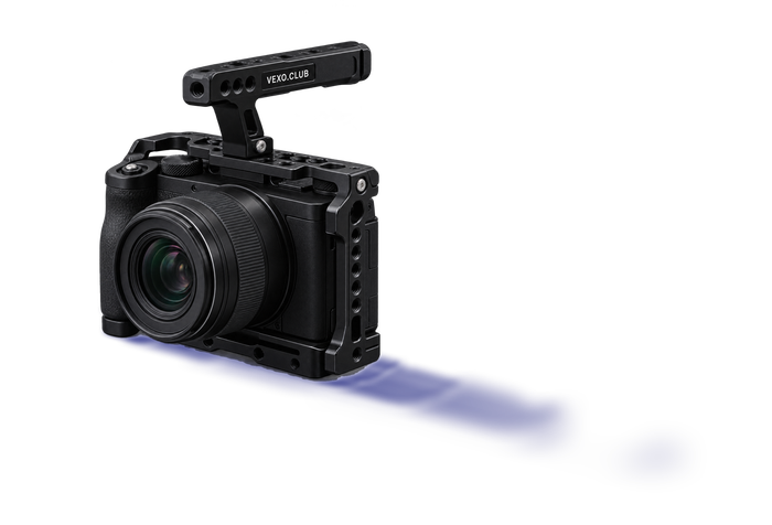 Mirrorless camera in a black cage with a top handle