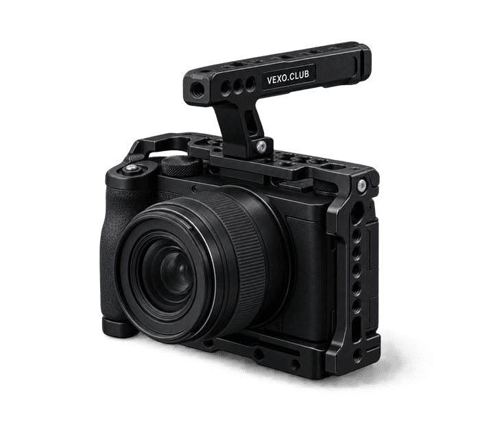 Mirrorless camera in a black cage with a top handle