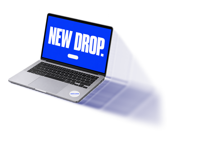 Open laptop showing a blue screen that reads “New drop.”