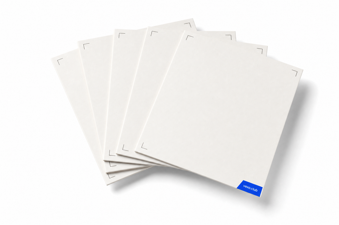 Fan of blank white proof cards with crop marks in their corners