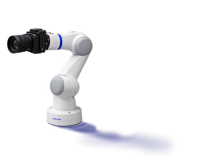 Robotic camera arm on a white base labelled vexo.club